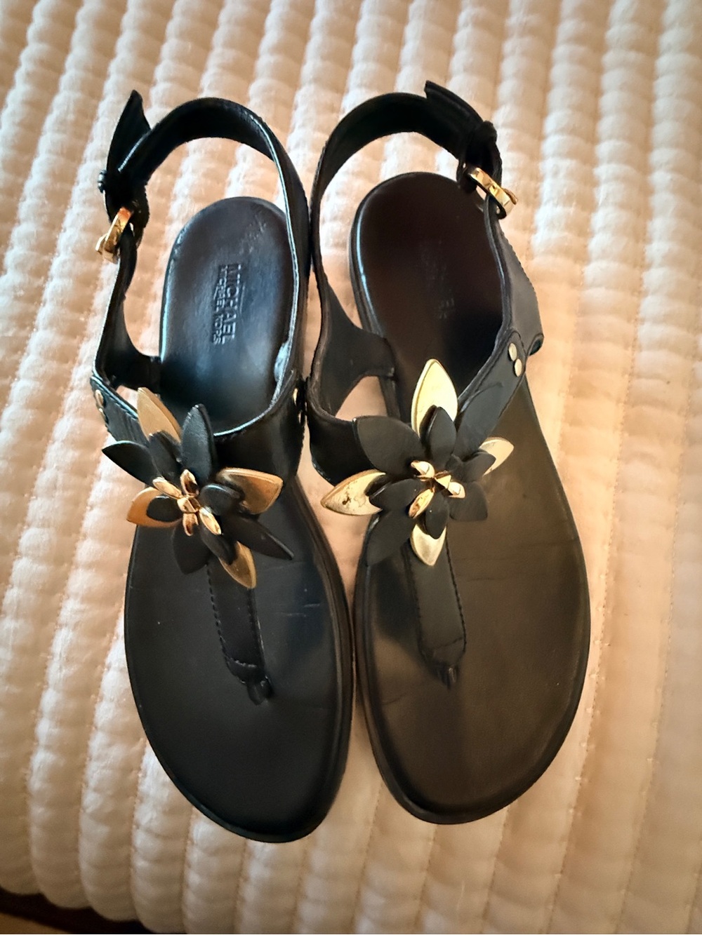 Michael Kors Collection Black T-Strap Sandals with Gold Floral Accent